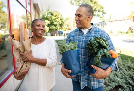 couple holding groceries