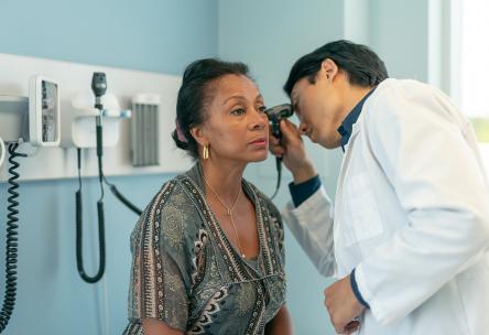 Woman at doctor appointment getting ears & hearing checked