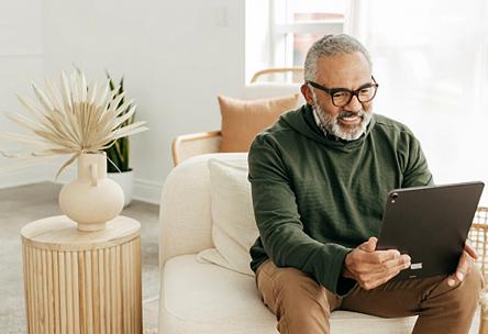 A man looking at a tablet.