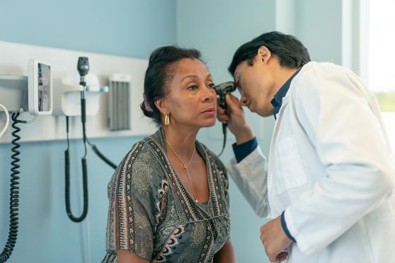 Woman at doctor appointment getting ears & hearing checked