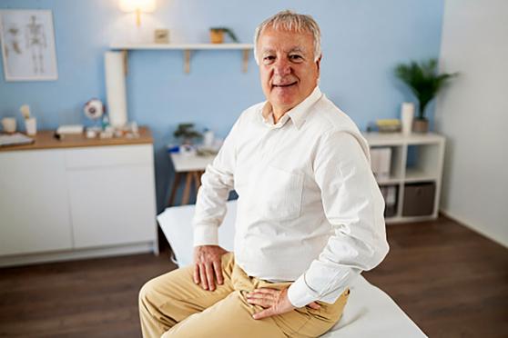 A man sitting in a doctor's office.